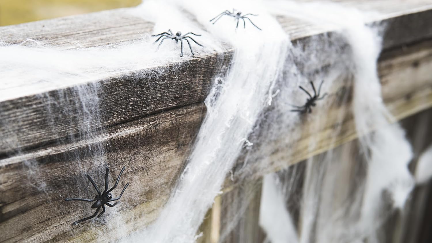 8 included plastic fake spiders bundled with the webbing