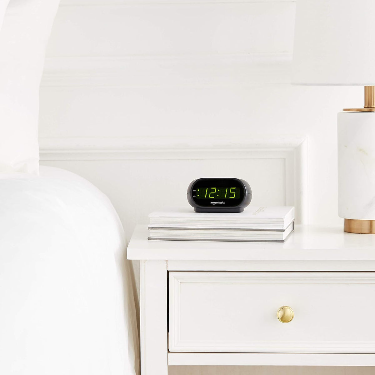 Amazon Basics Oval Digital Clock with Nightlight – Clean-Design Bedside Clock for Less-Is-More Homes