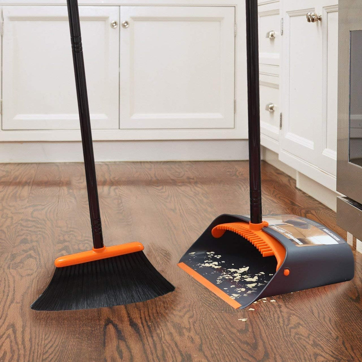 dustpan locks in open position for hands-free, spill-free disposal