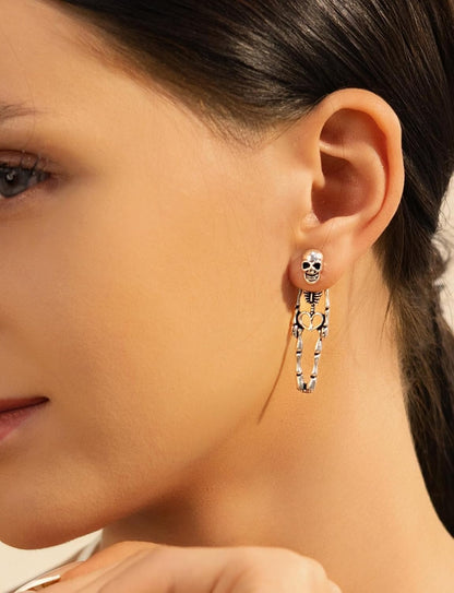 halloween-specific motifs (witch, skeleton, pumpkin, black cat) aligned with classic holiday iconography