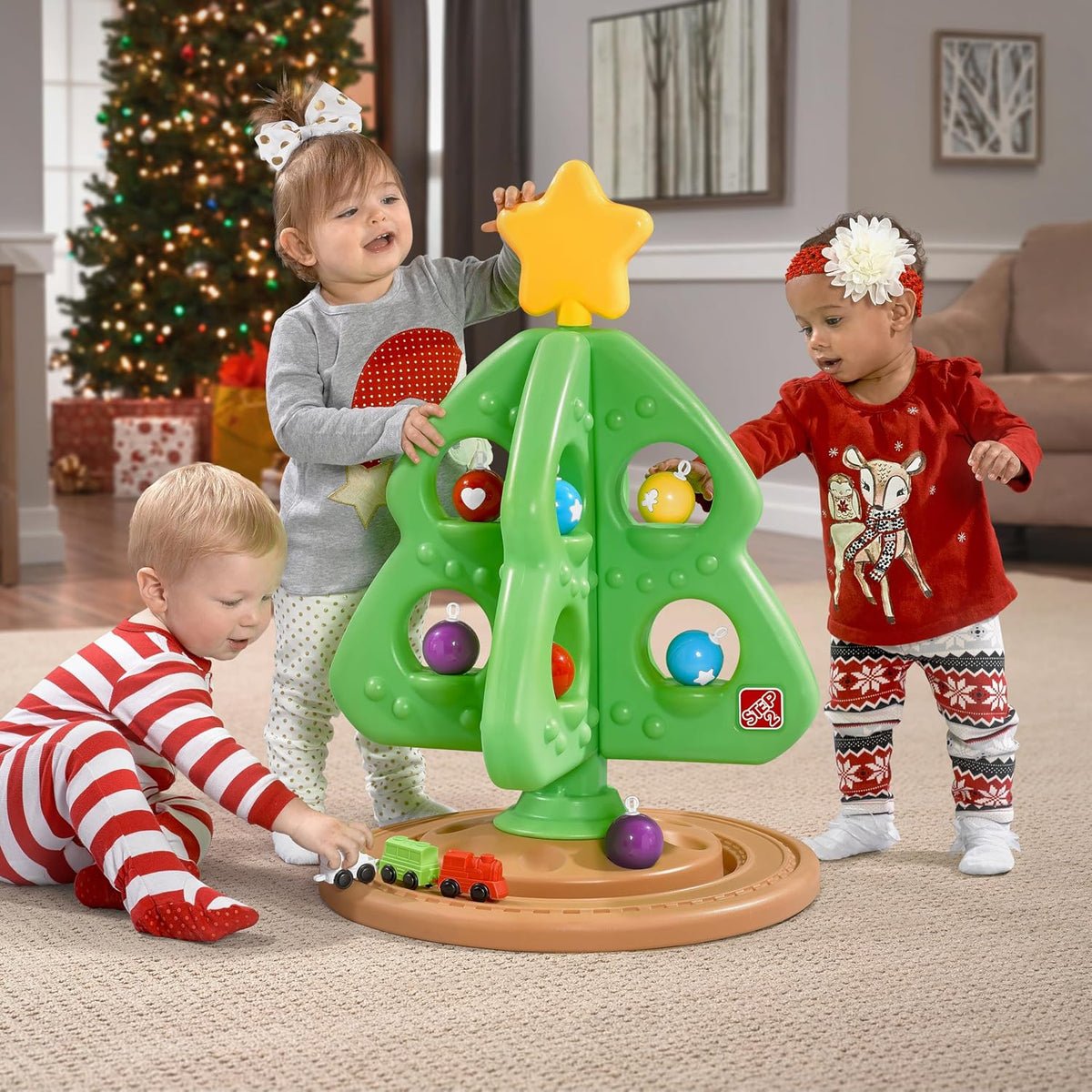 included ornament set and manually operated three-piece miniature train