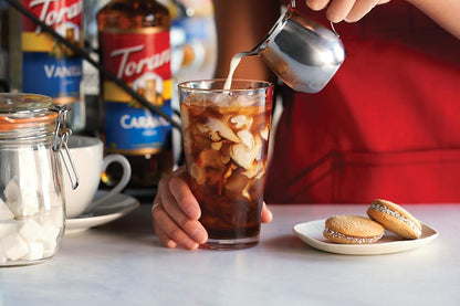 ingredients list featuring real vanilla extract with natural flavors, plus standard preservatives (potassium sorbate, sodium benzoate) and xanthan gum for body