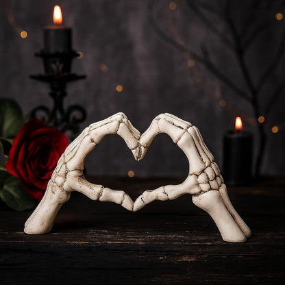 intricately detailed skeleton hand forming a heart gesture with polished finish