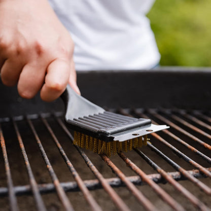 metal scraping edge designed to remove tough, caked-on grease and residue