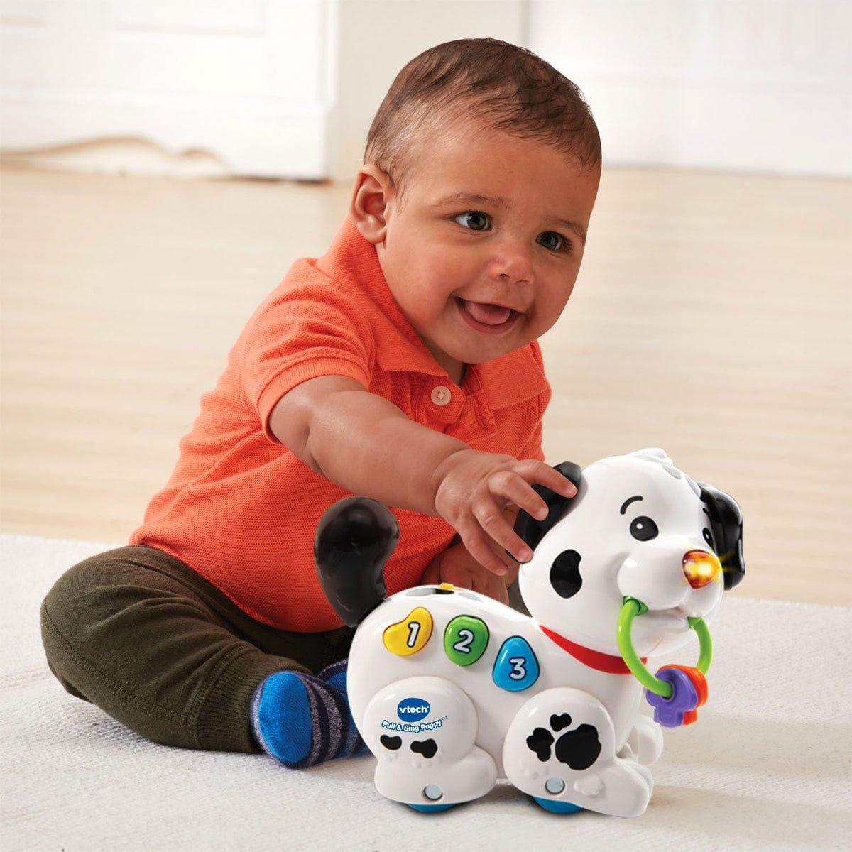 moving legs and swinging keys that reinforce active, floor-based play