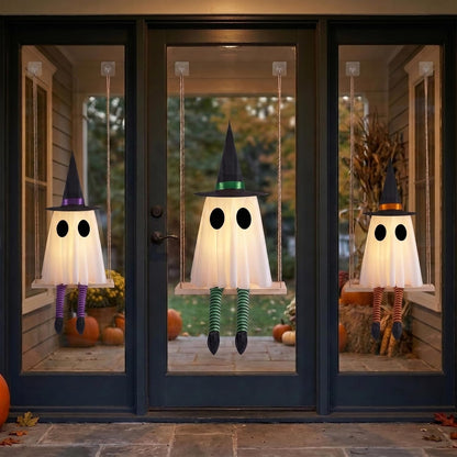 white gauze ghost body with printed eyes, black witch hat, and purple/green/orange striped witch legs